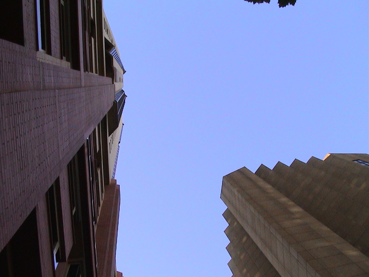 LOW ANGLE VIEW OF BUILDINGS AGAINST CLEAR SKY