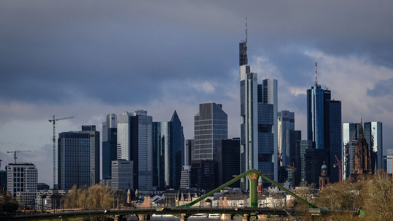 View of cityscape against cloudy sky