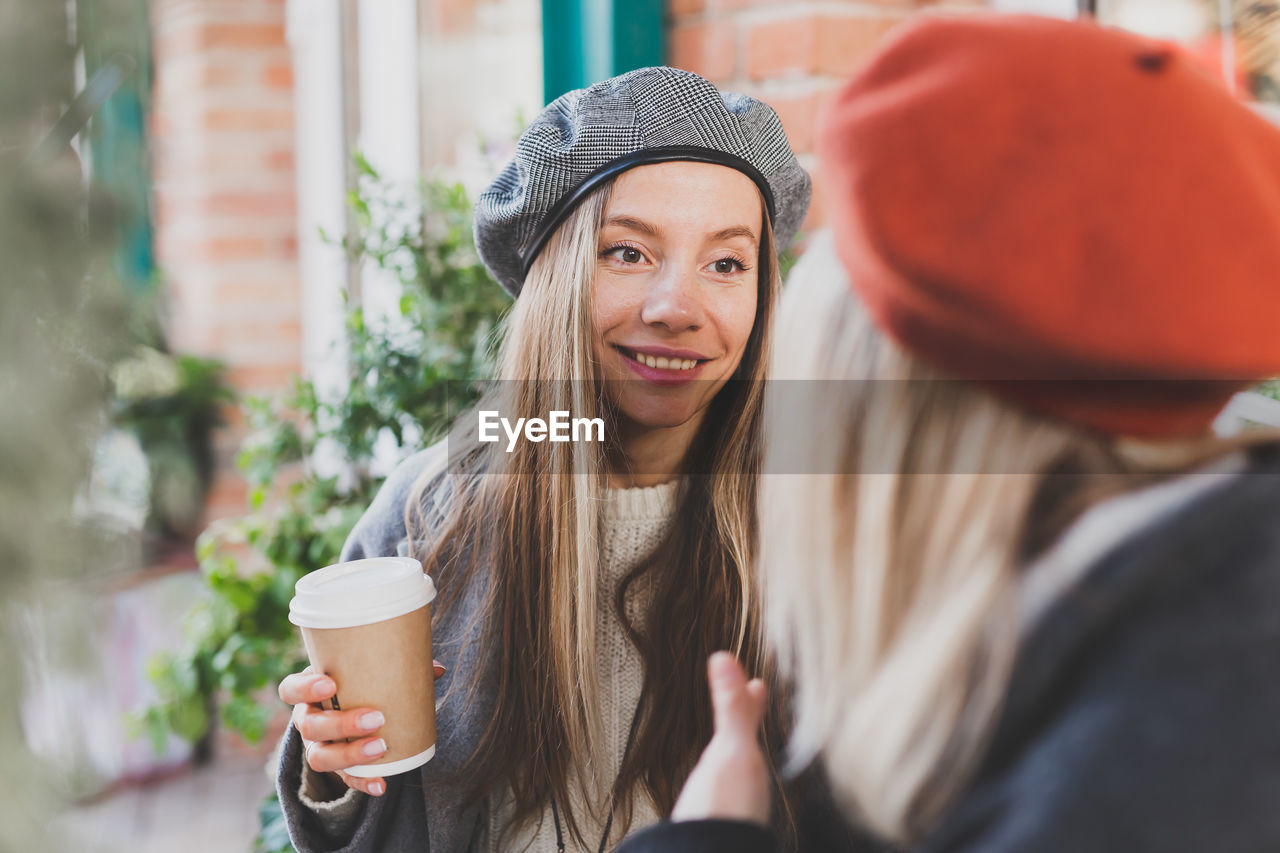 portrait of young woman drinking coffee