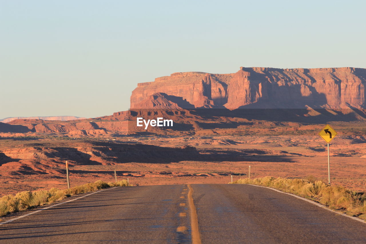 Empty road passing through mountain