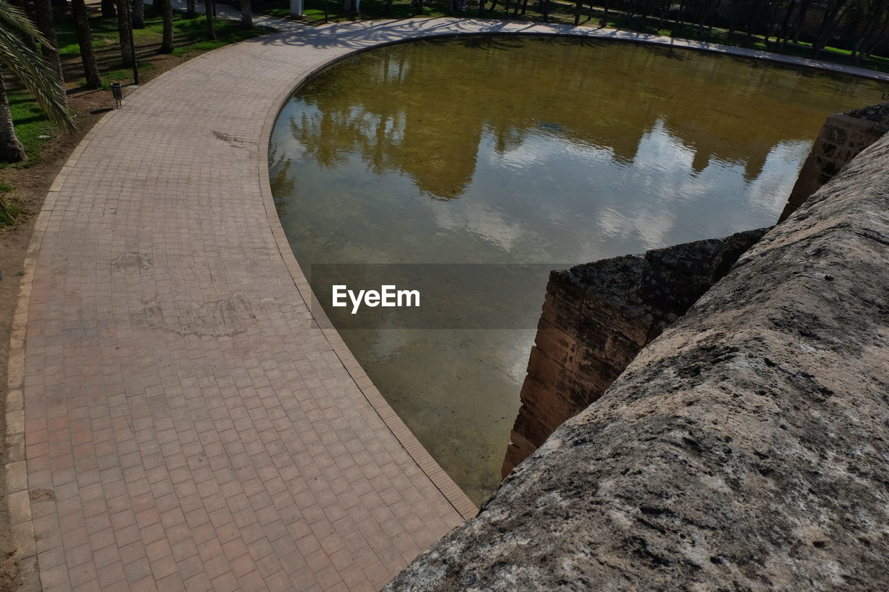 HIGH ANGLE VIEW OF REFLECTION OF WATER IN PUDDLE