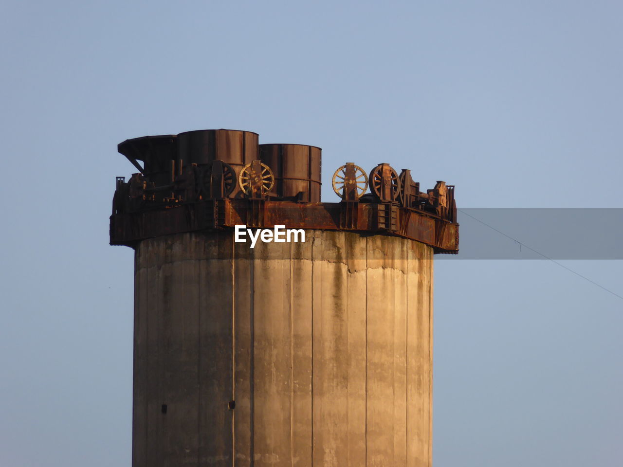 Low angle view of built structure against clear blue sky