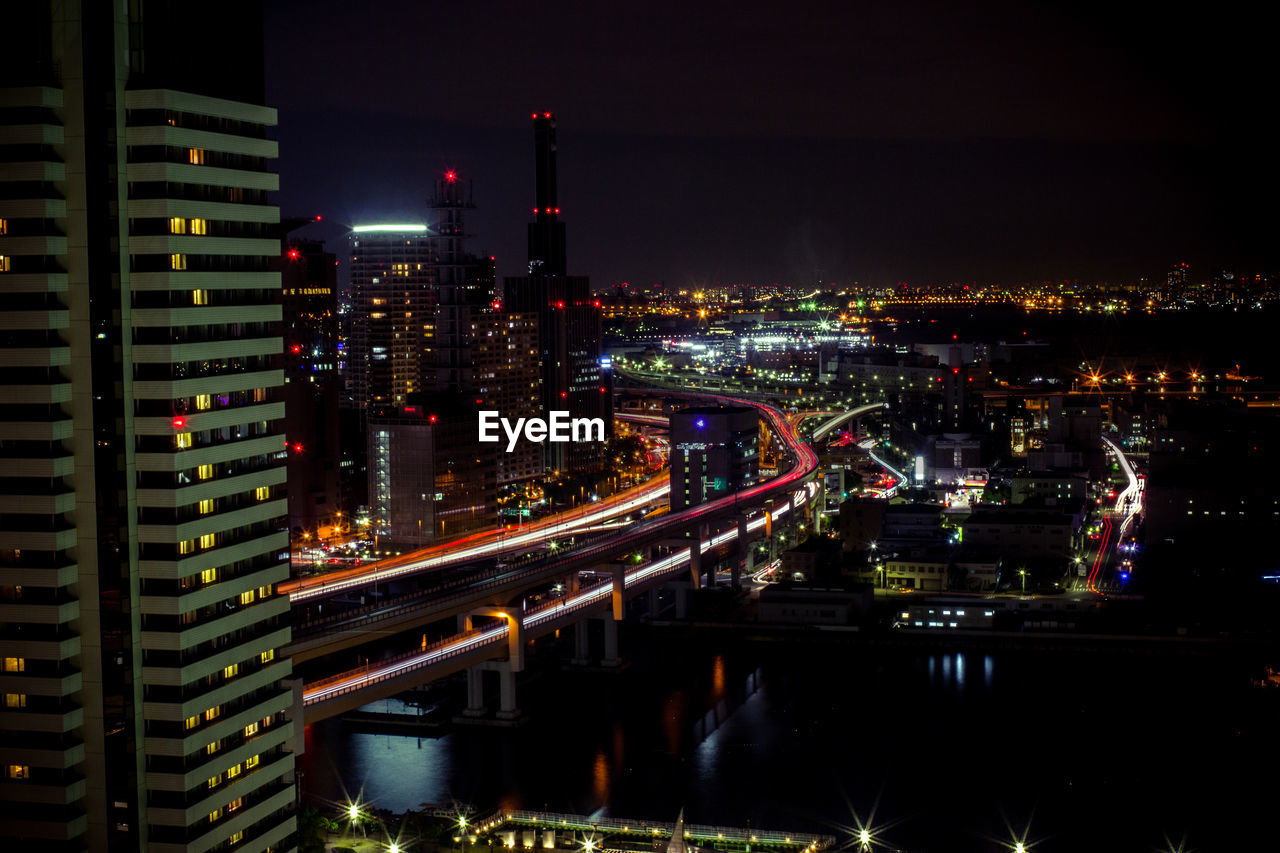 ILLUMINATED CITYSCAPE AT NIGHT