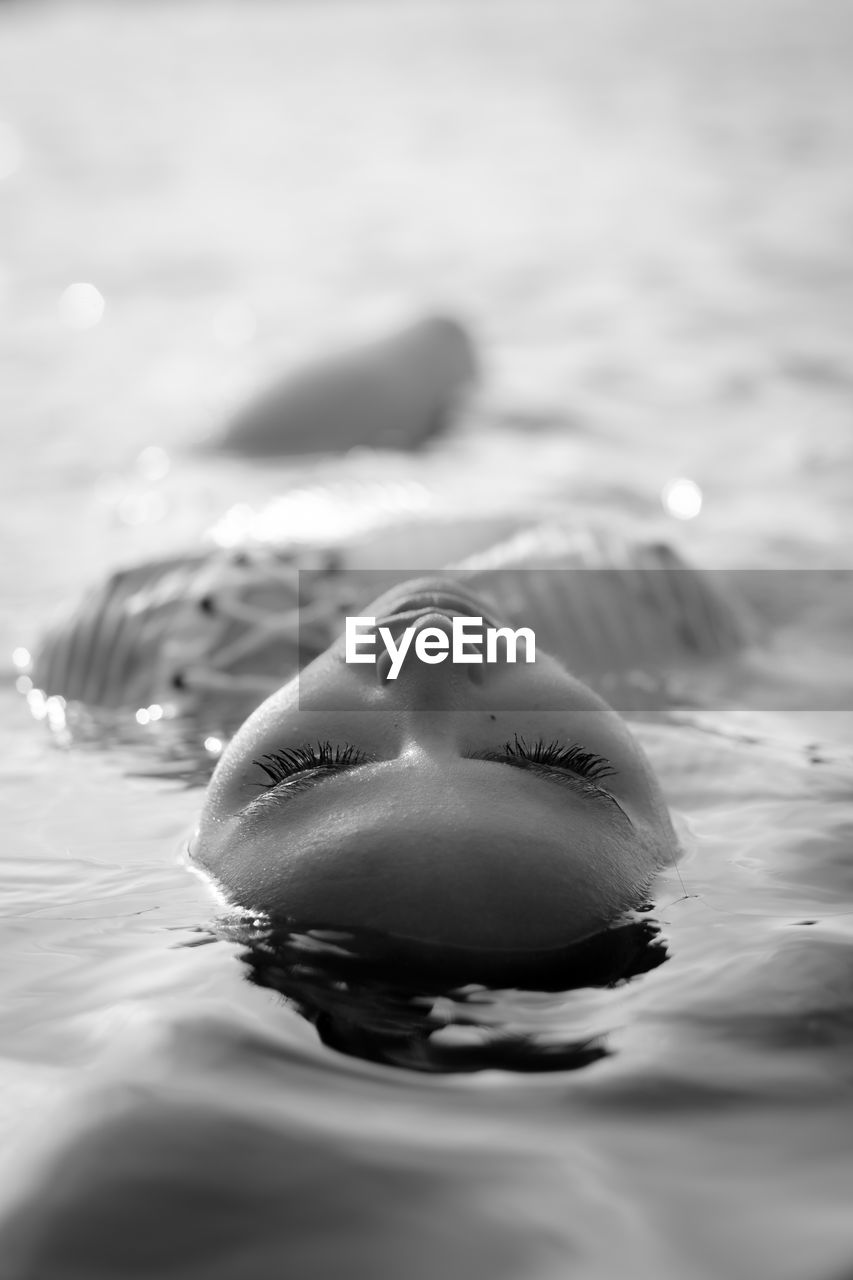 Close-up of woman swimming in sea