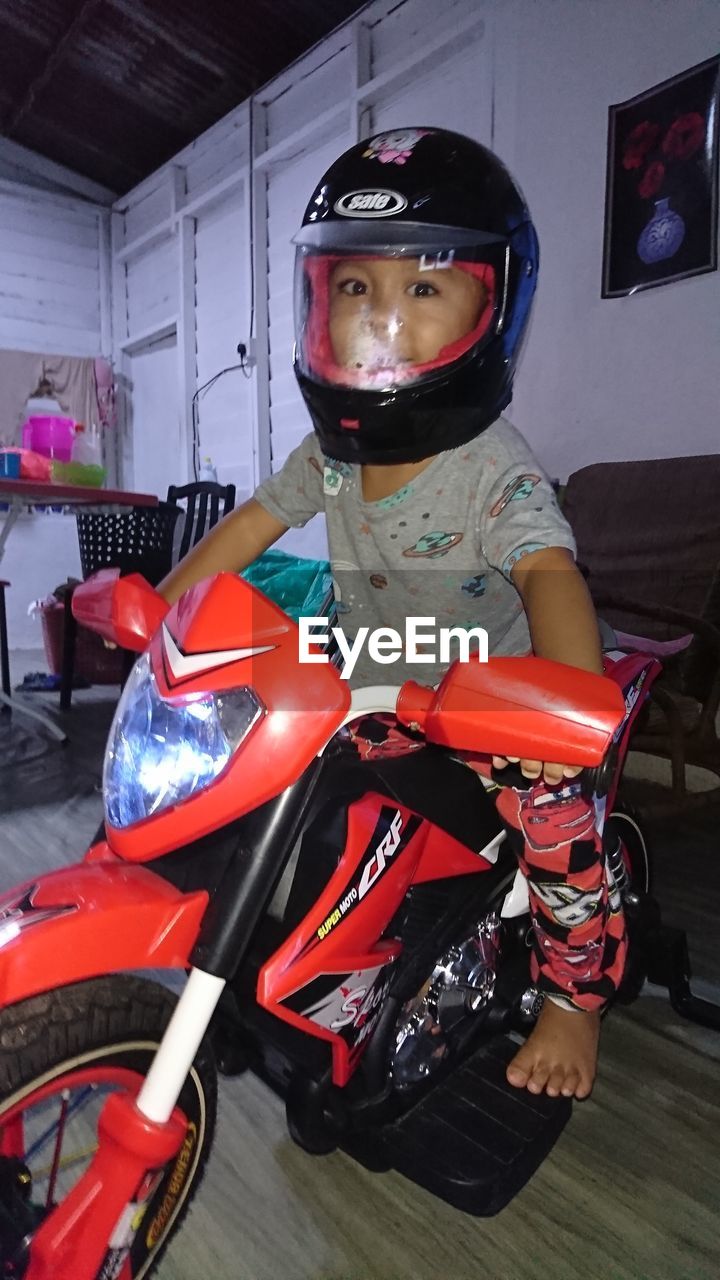 PORTRAIT OF A MAN RIDING MOTORCYCLE AT BUS