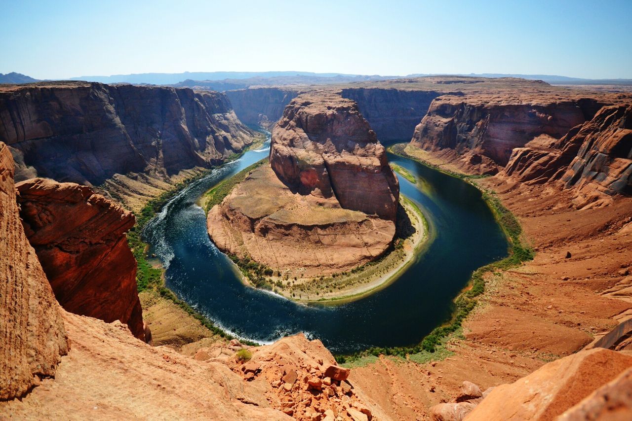 Scenic view of horseshoe bend against clear sky