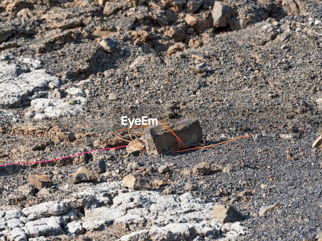 soil, day, geology, rock, no people, nature, land, high angle view, sunlight, rubble, outdoors, beach, textured, sand, damaged