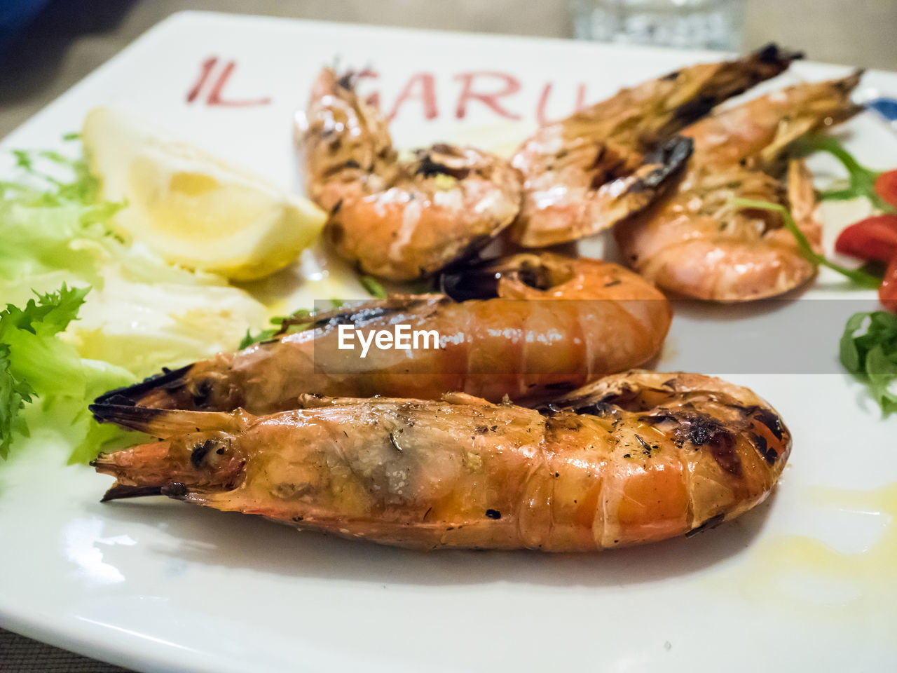 CLOSE-UP OF FISH ON BARBECUE GRILL