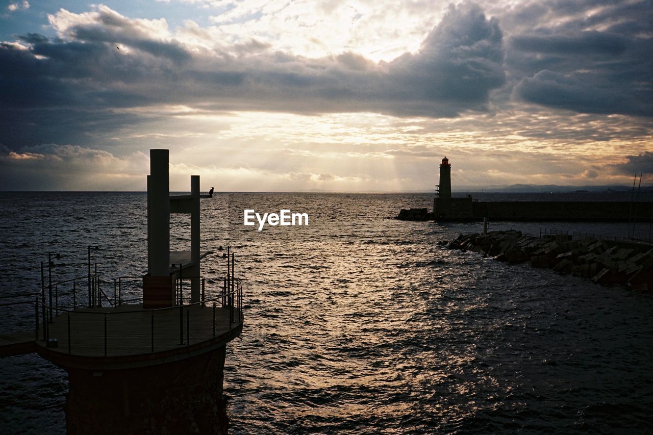 Scenic view of sea against cloudy sky