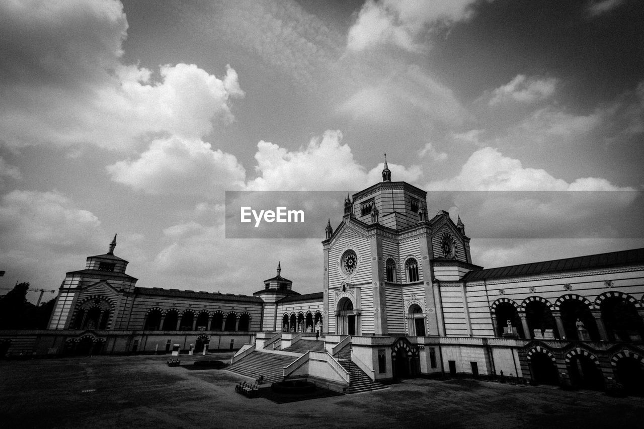 Low angle view of famedio in cimitero monumentale against cloudy sky