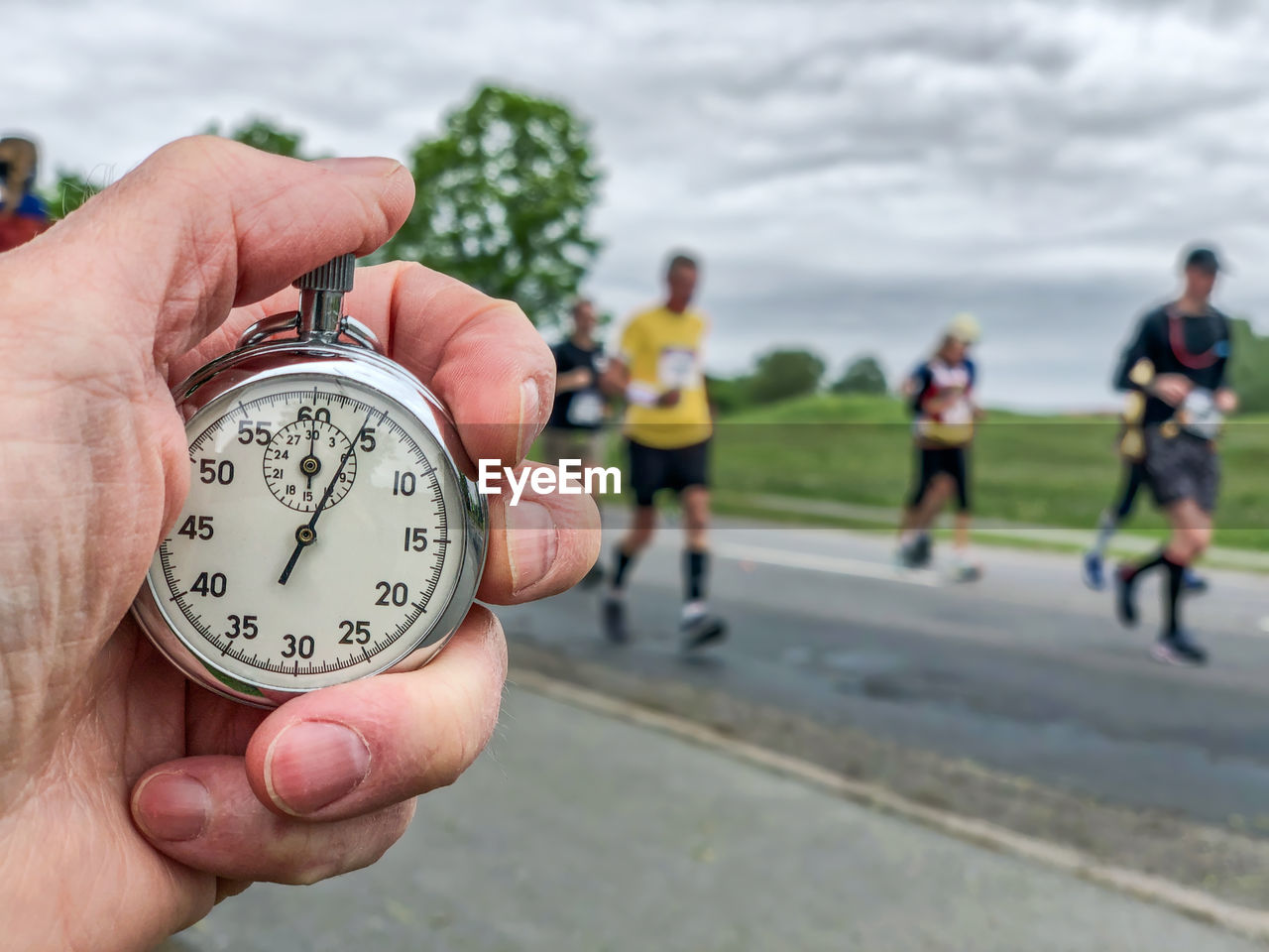 time, hand, group of people, adult, holding, sky, focus on foreground, men, sports, watch, day, clock, competition, lifestyles, outdoors, nature, athlete, exercising, activity, timer