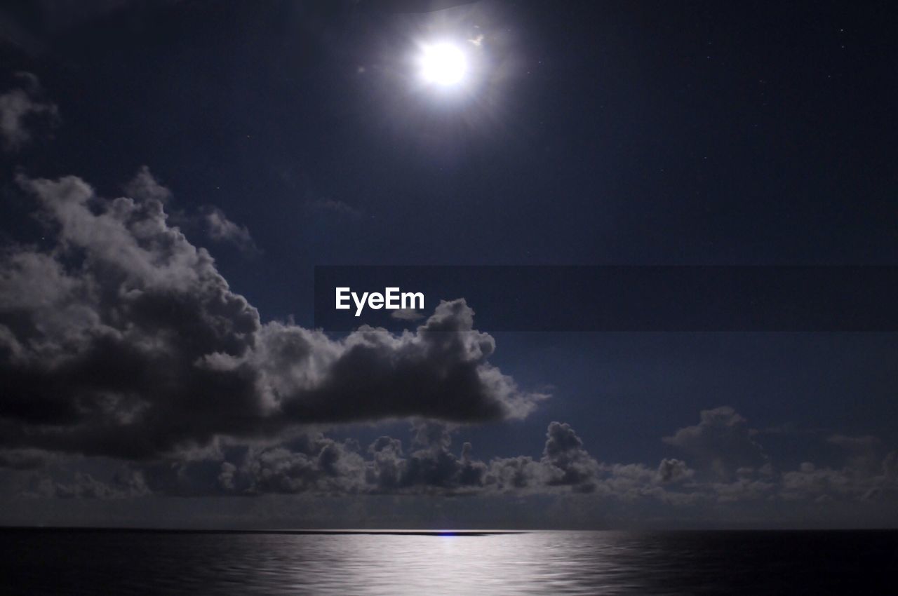 Scenic view of sea against sky at night