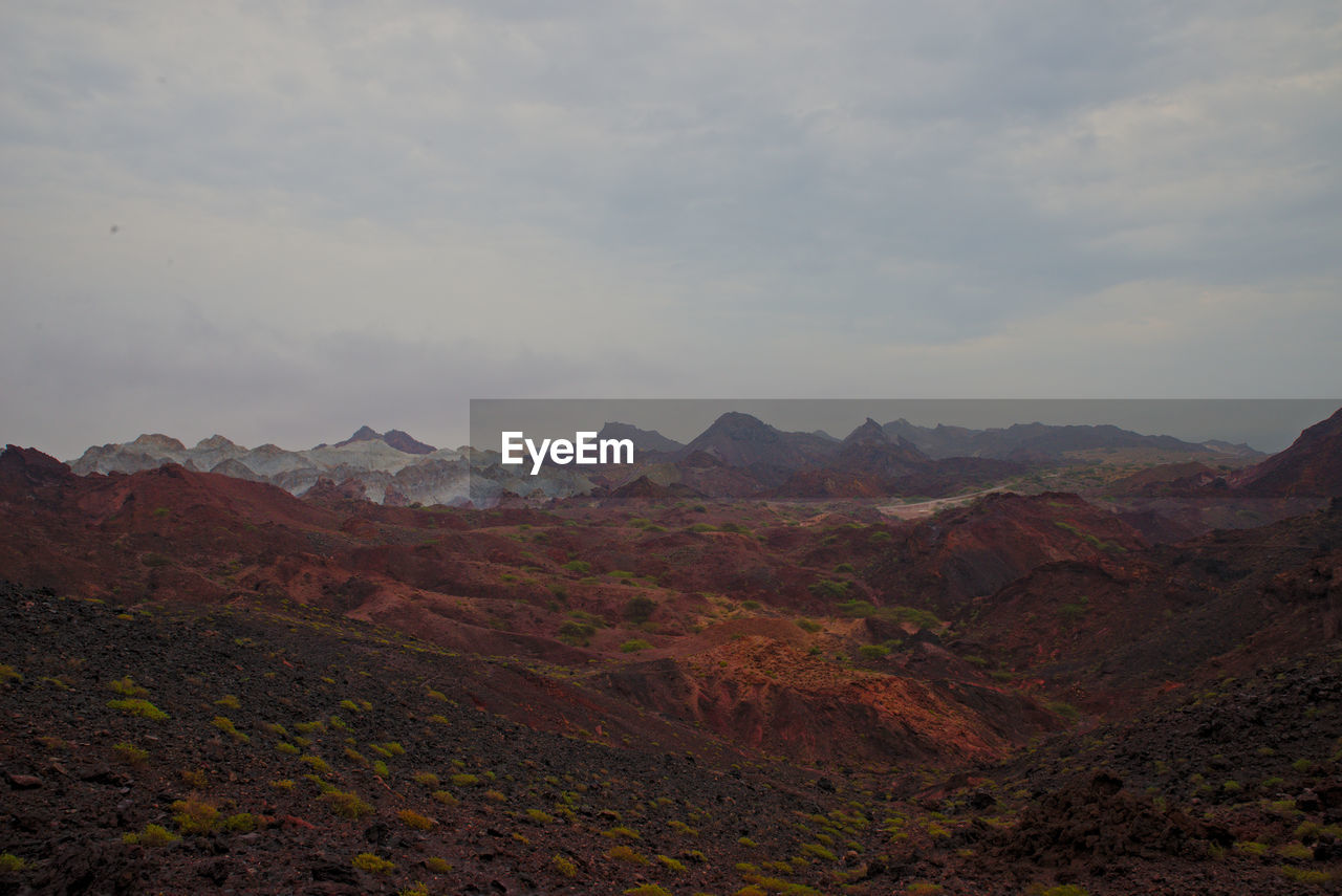 Scenic view of colorful rocky mountains against sky