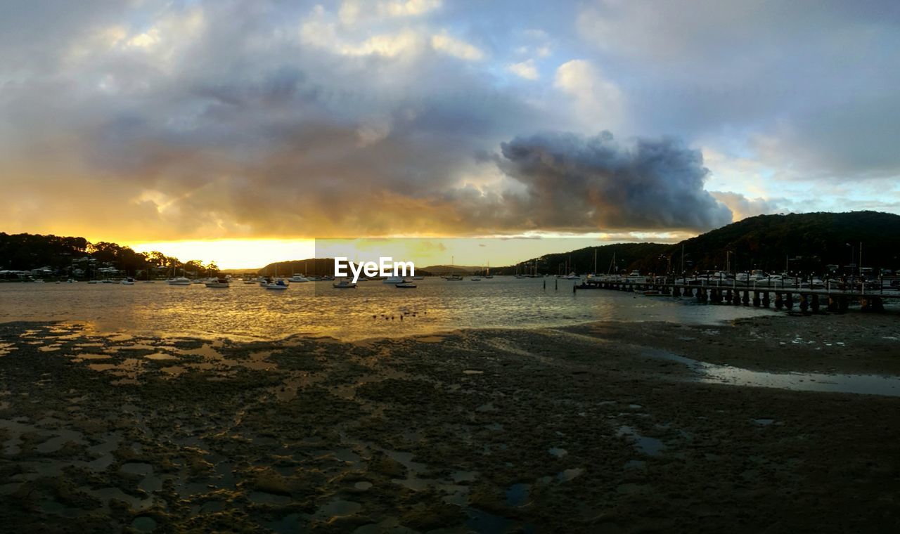 SCENIC VIEW OF BEACH DURING SUNSET