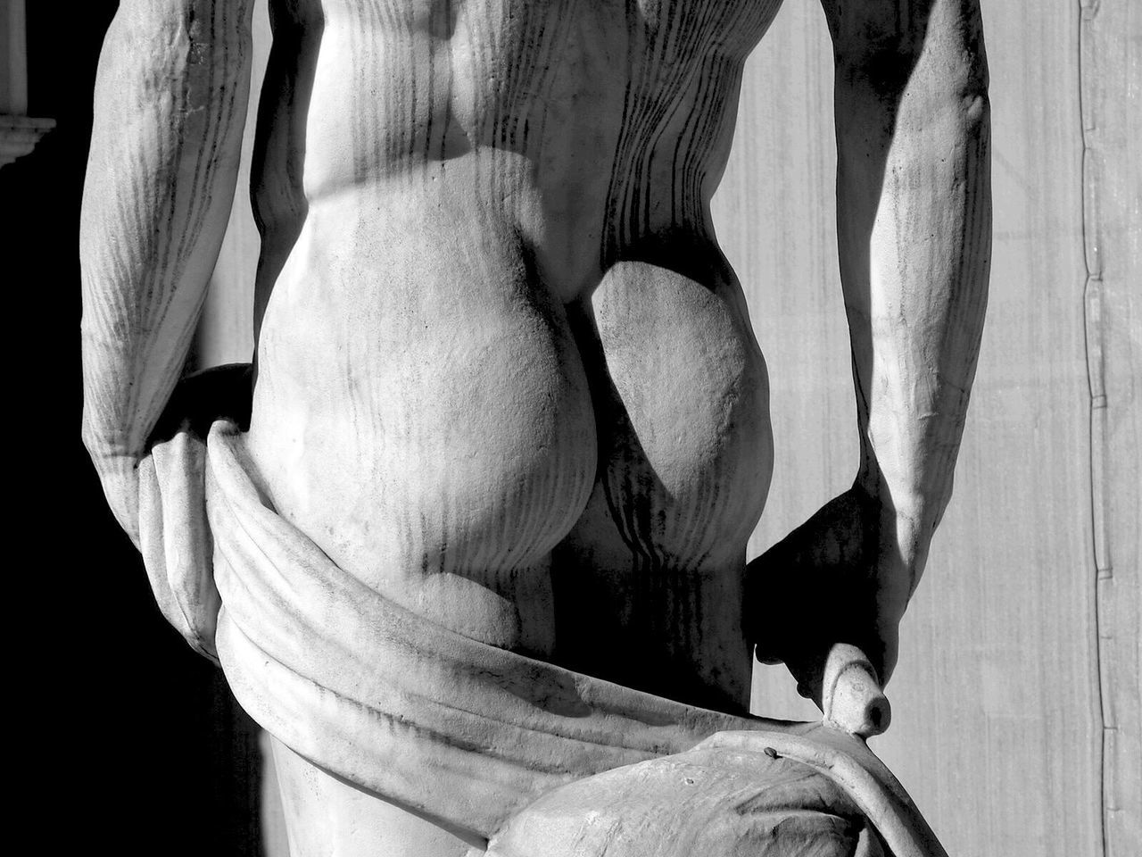 REAR VIEW OF HUMAN STATUE