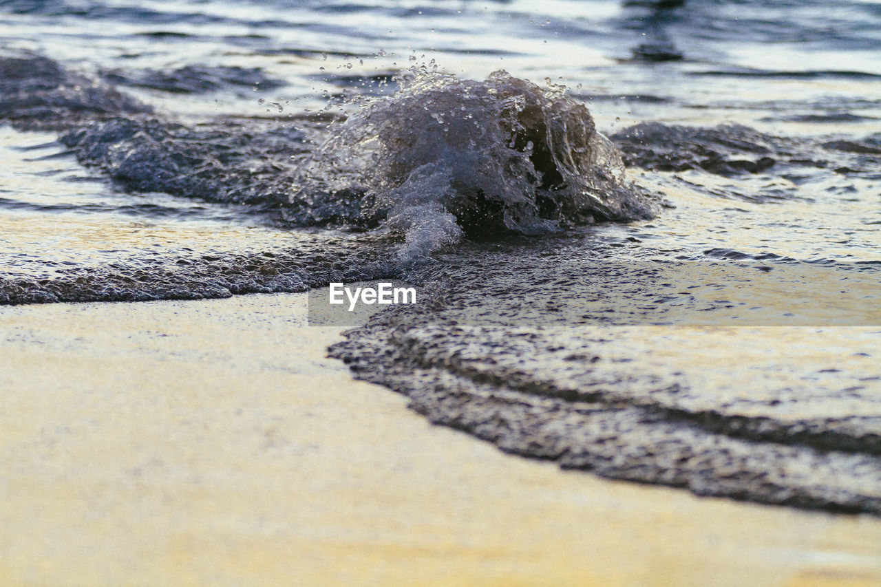 Close-up of wave on beach