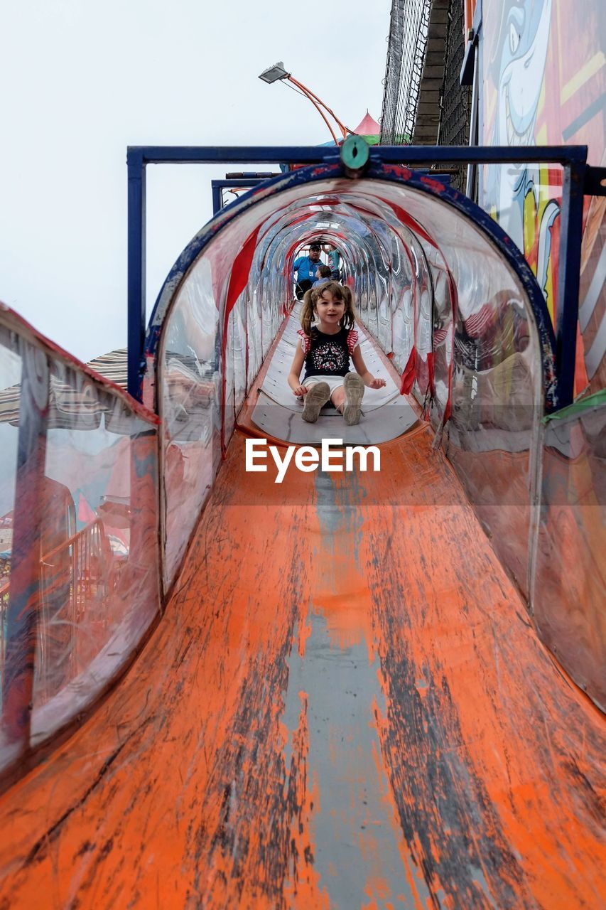 Girl playing at slide