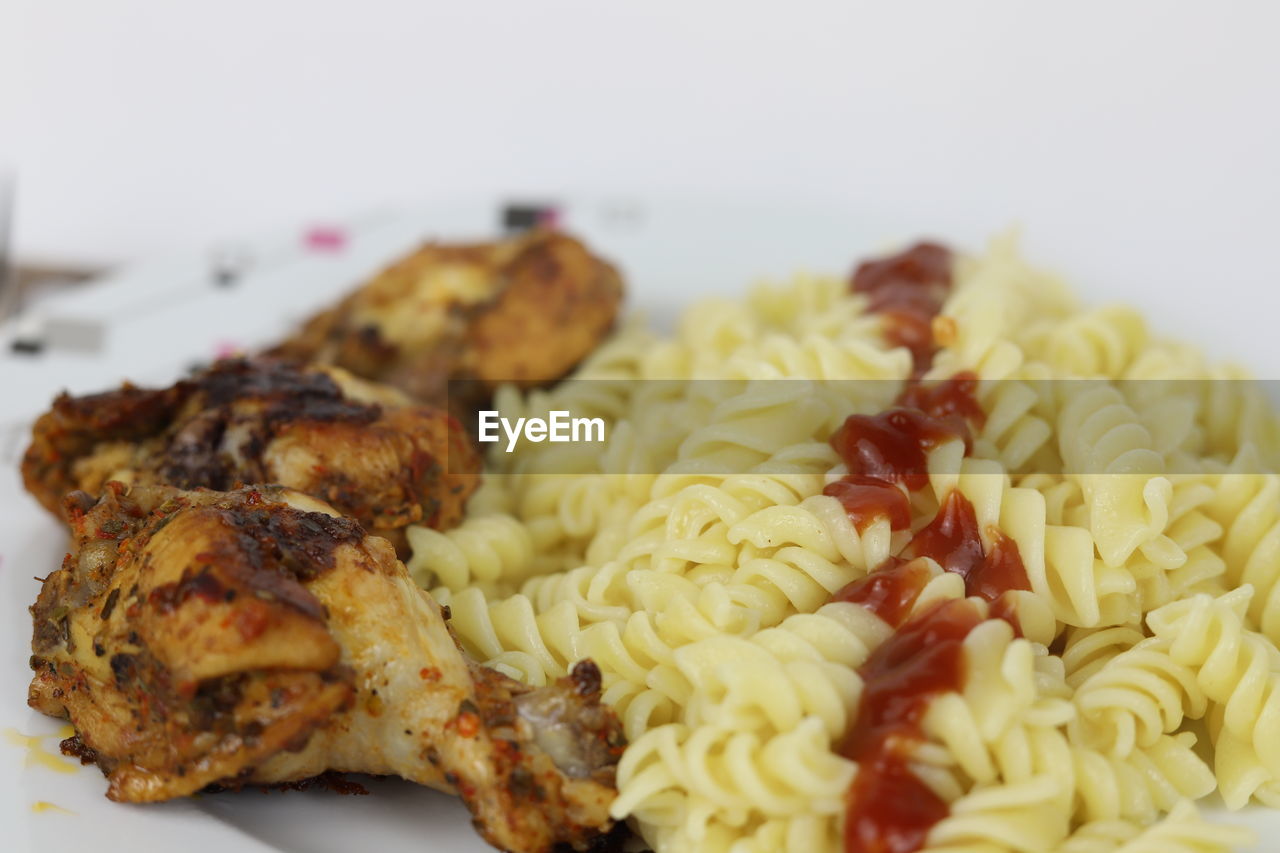 food, food and drink, freshness, dish, cuisine, meat, healthy eating, indoors, wellbeing, plate, close-up, meal, no people, produce, vegetable, spaghetti, italian food, still life, chicken meat, serving size, focus on foreground, pasta