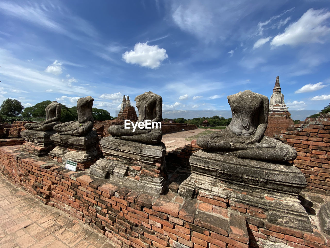 Ruins of temple against cloudy sky