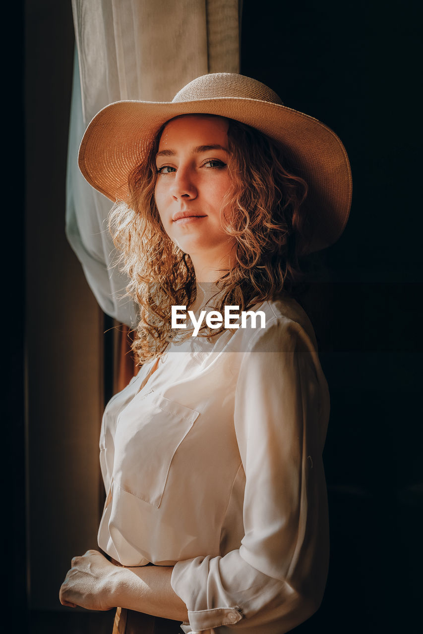 Portrait of woman wearing hat