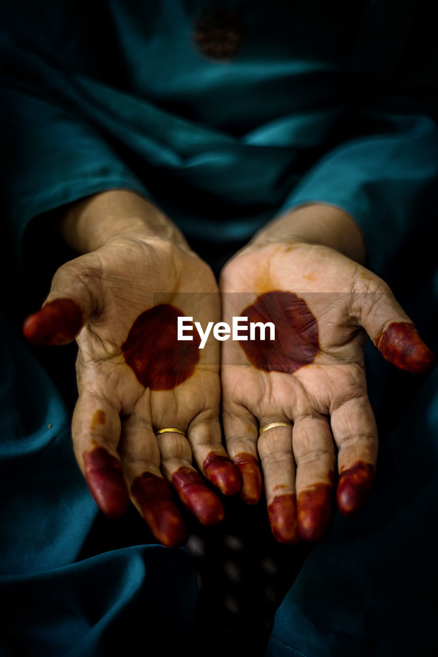 Close-up of human hand with henna tattoo