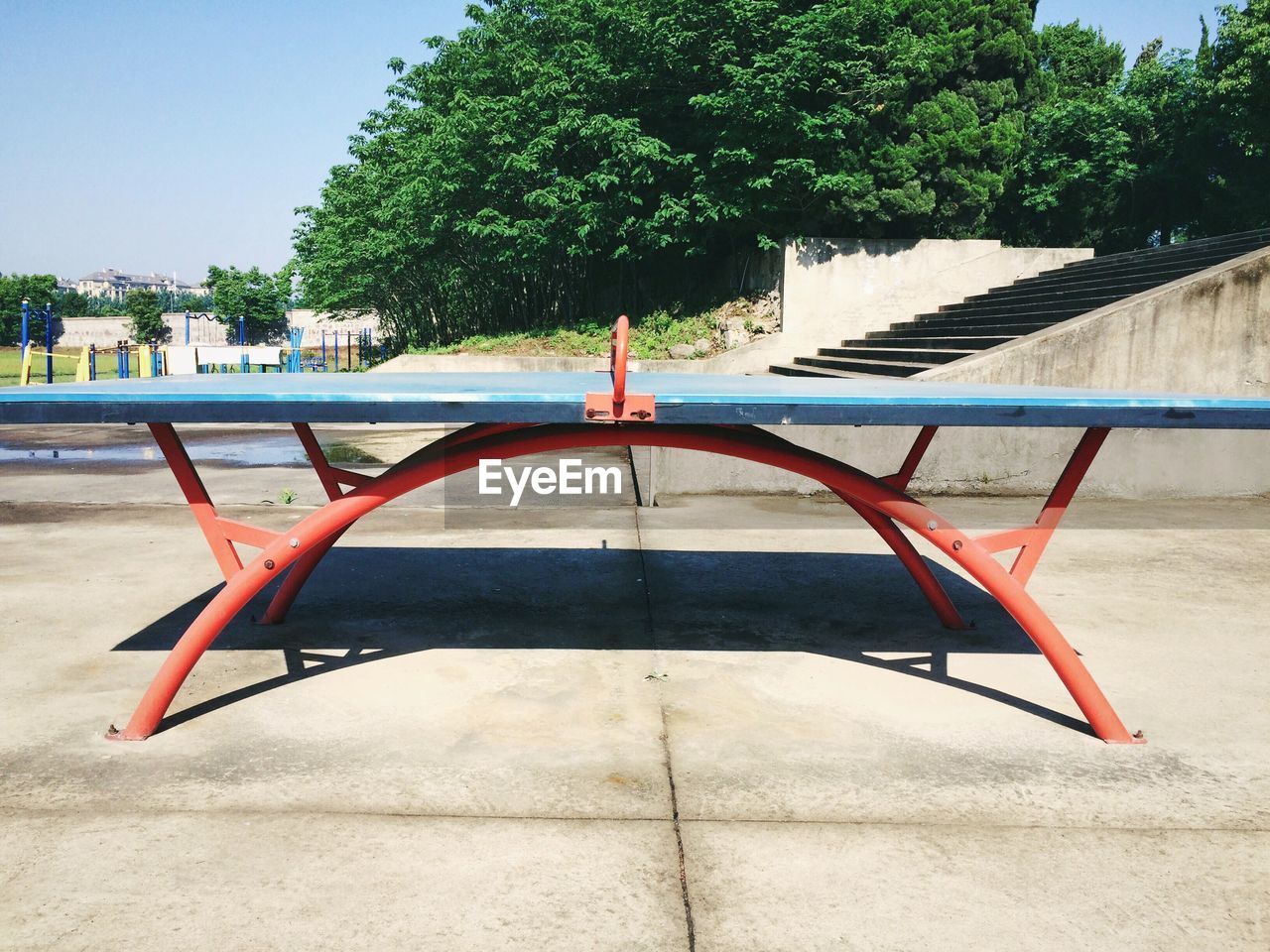 Table tennis table park against clear sky