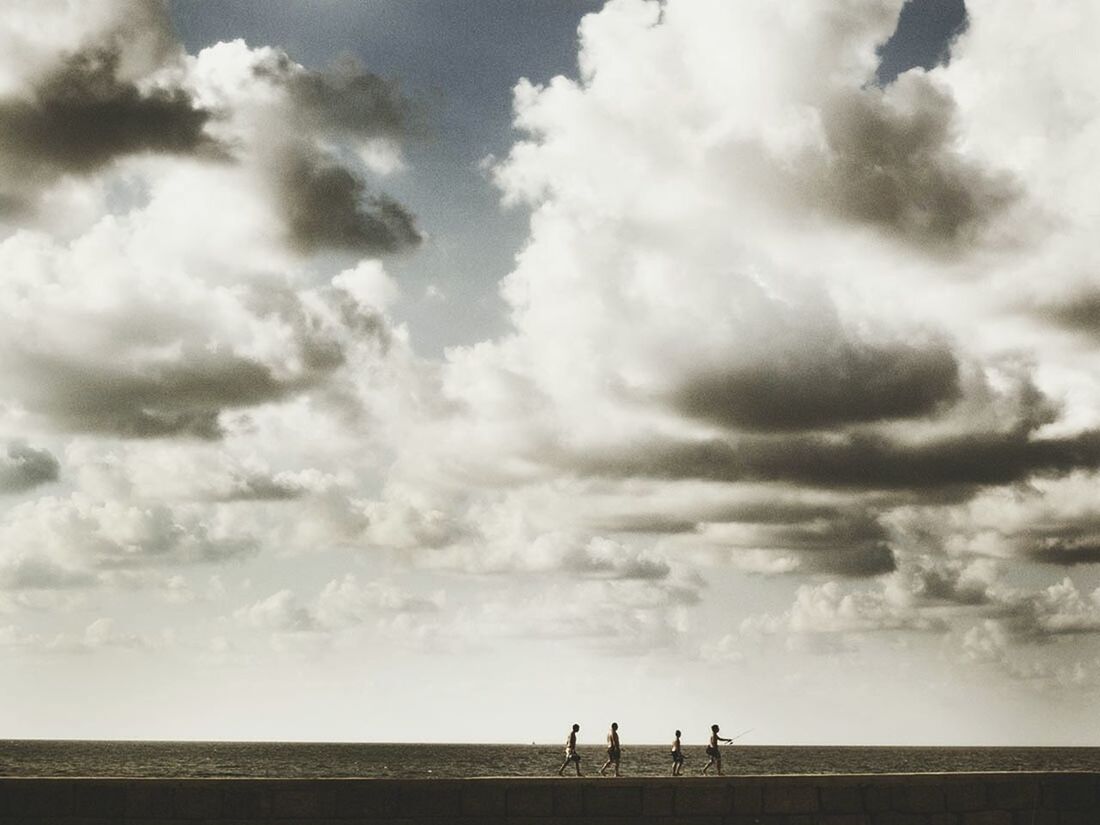 SEA AGAINST CLOUDY SKY