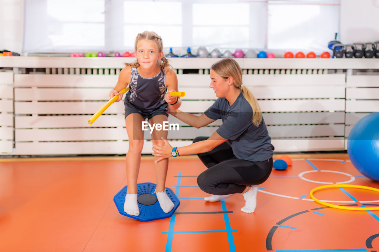 Balance exercises for children, using balancing disks