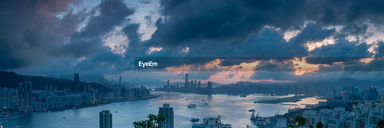 High angle view of buildings against dramatic sky