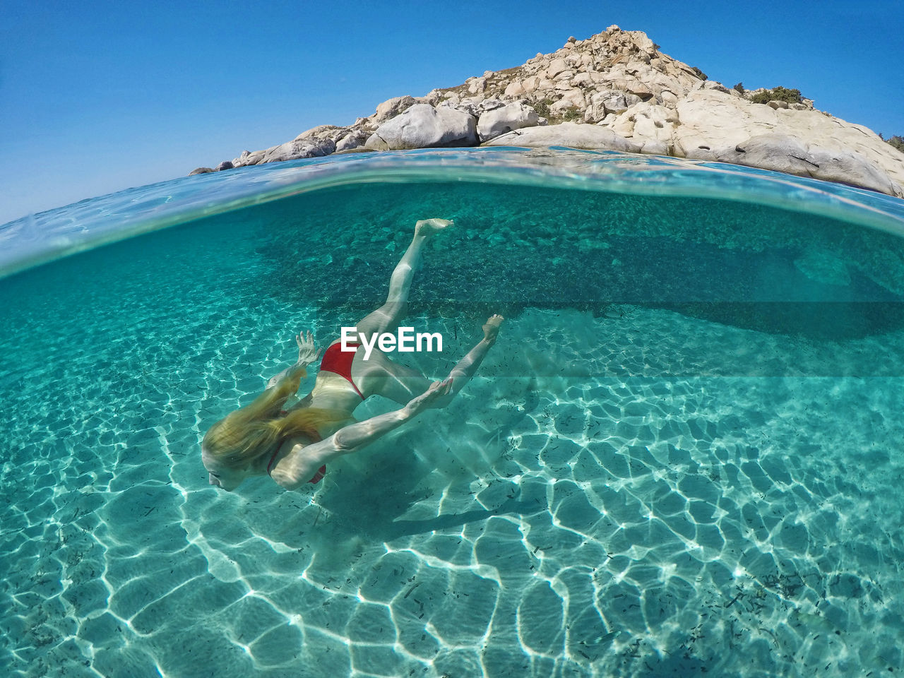 MAN SWIMMING IN SEA