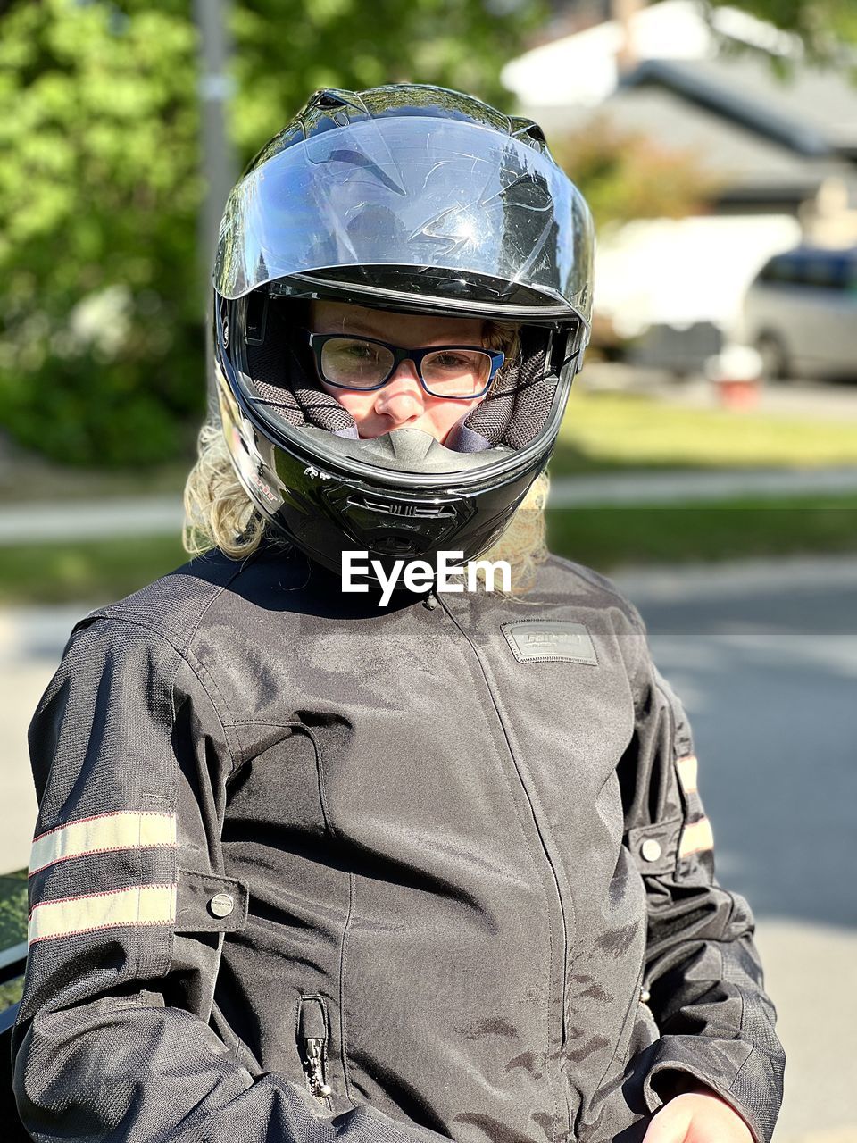 helmet, headwear, one person, sports helmet, sports, motorcycle helmet, crash helmet, protection, portrait, transportation, work helmet, men, security, sports equipment, day, clothing, personal protective equipment, front view, focus on foreground, person, looking at camera, mode of transportation, outdoors, vehicle, emotion, adult, military