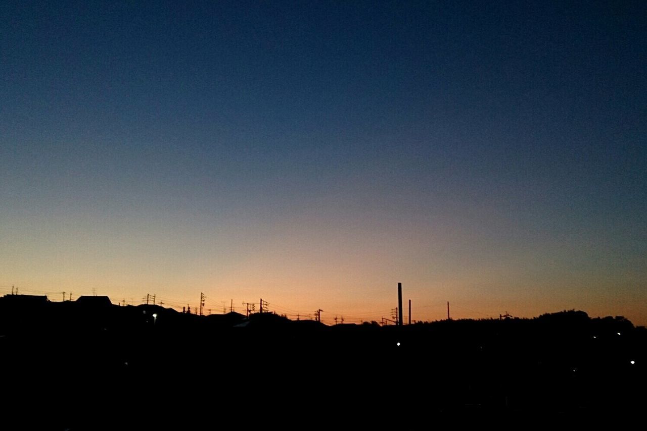 SILHOUETTE OF TREES AGAINST CLEAR SKY