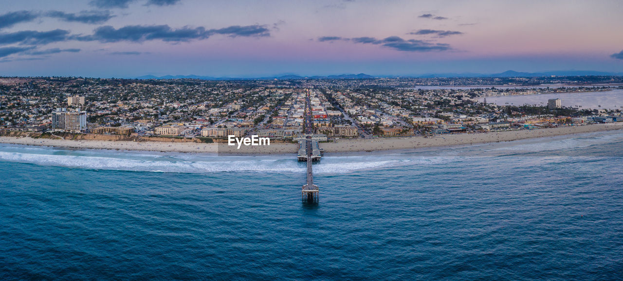 Panorama crystal pier pacific beach san diego sunrise aerial.