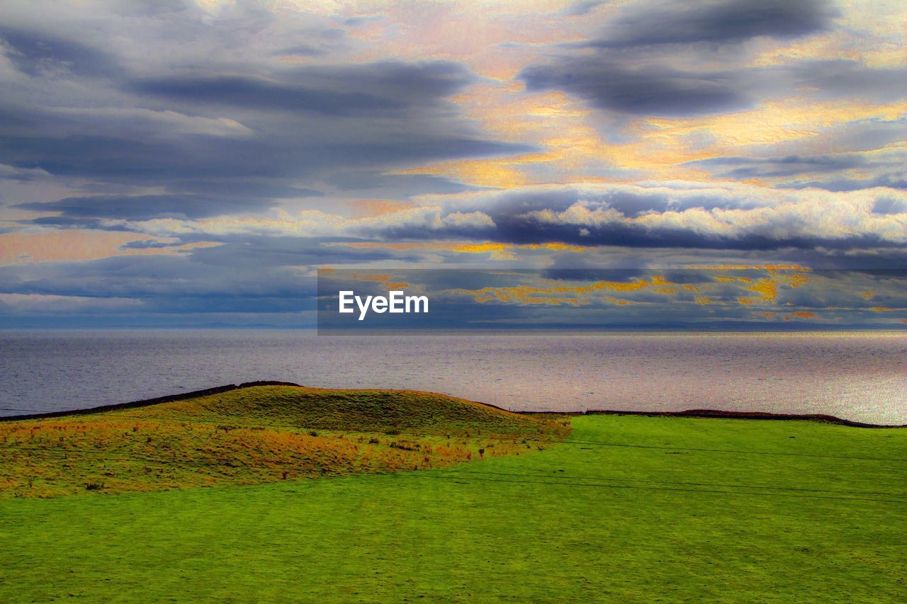 SCENIC VIEW OF DRAMATIC SKY OVER LANDSCAPE