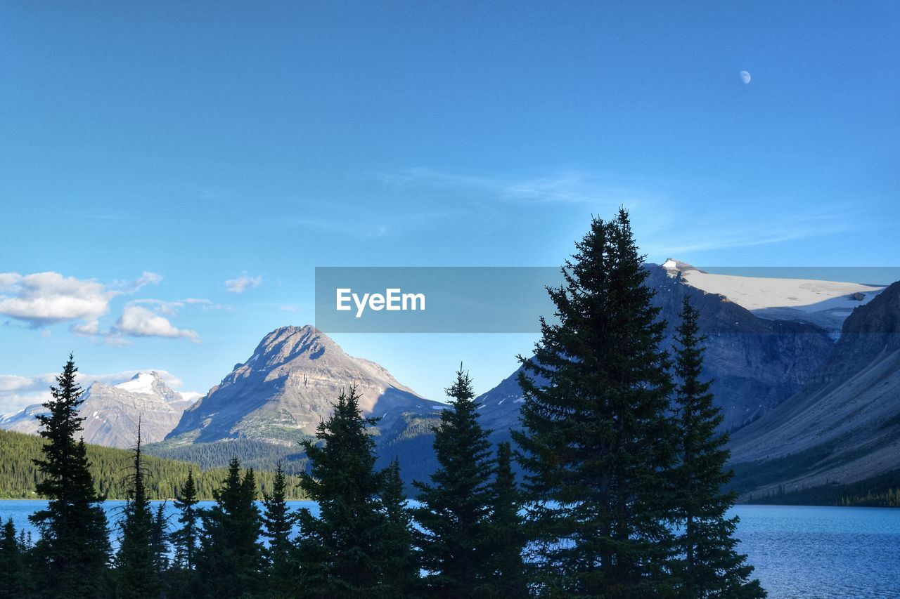 Scenic view of lake with mountains in background