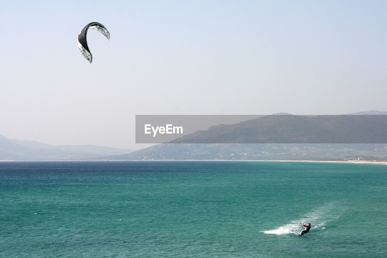 Kitesurfing view of sea against clear sky