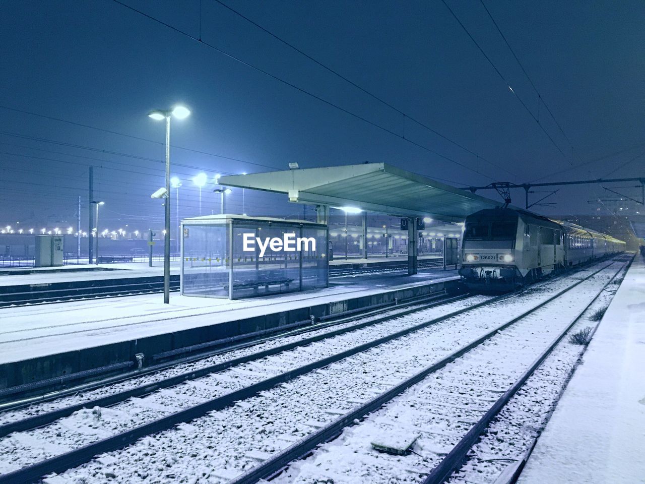 Railroad station during winter at night