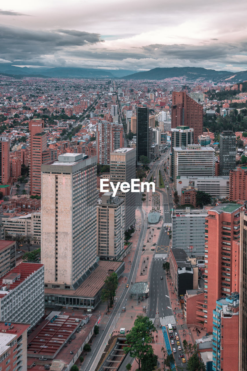 High angle view of buildings in city against sky