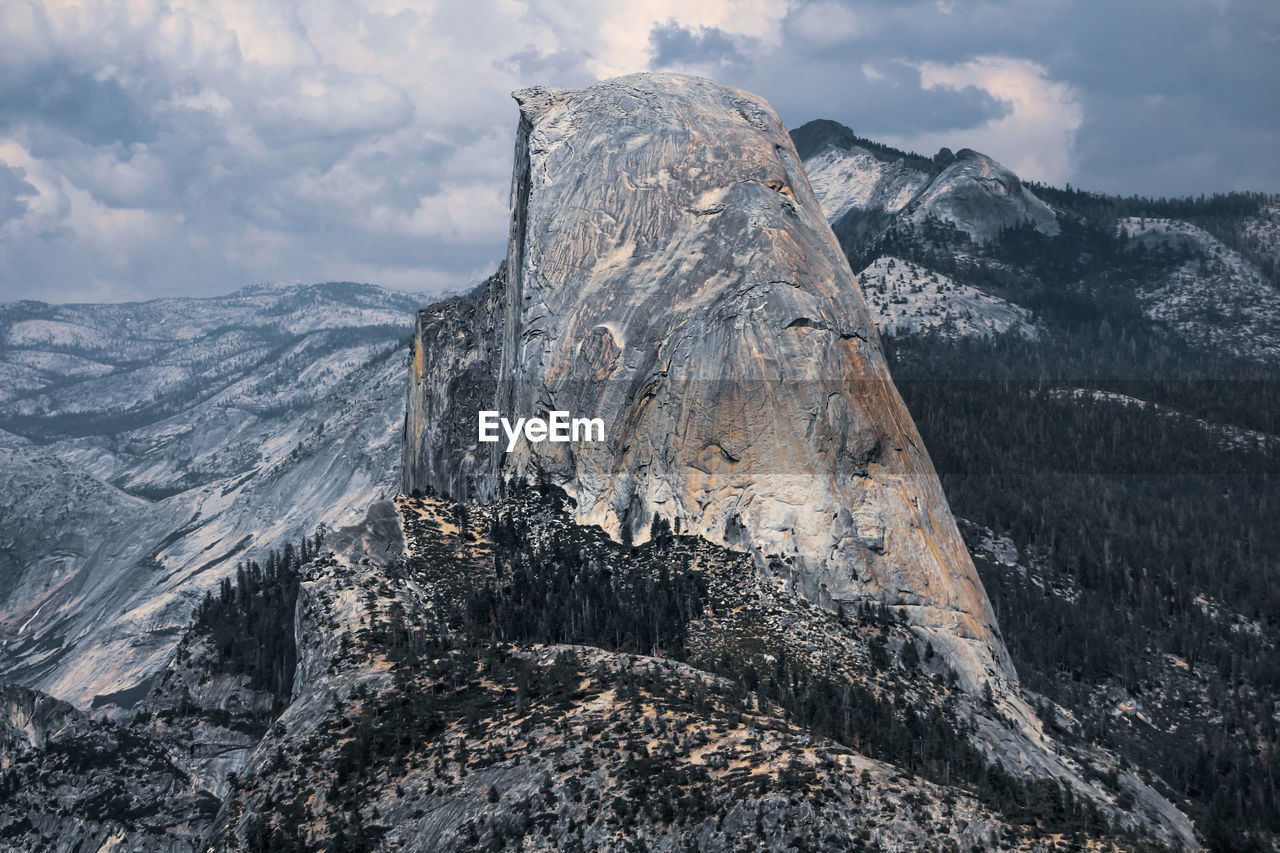 Scenic view of yosemite half dome snowcapped mountains against sky