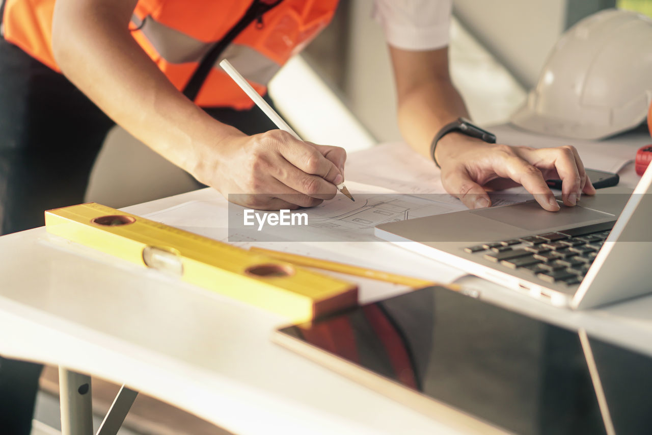 PEOPLE WORKING ON TABLE