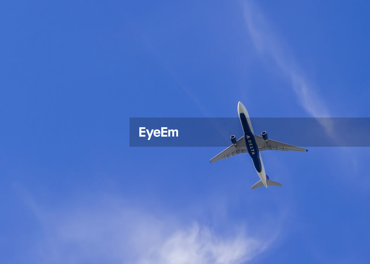 LOW ANGLE VIEW OF AIRPLANE AGAINST SKY