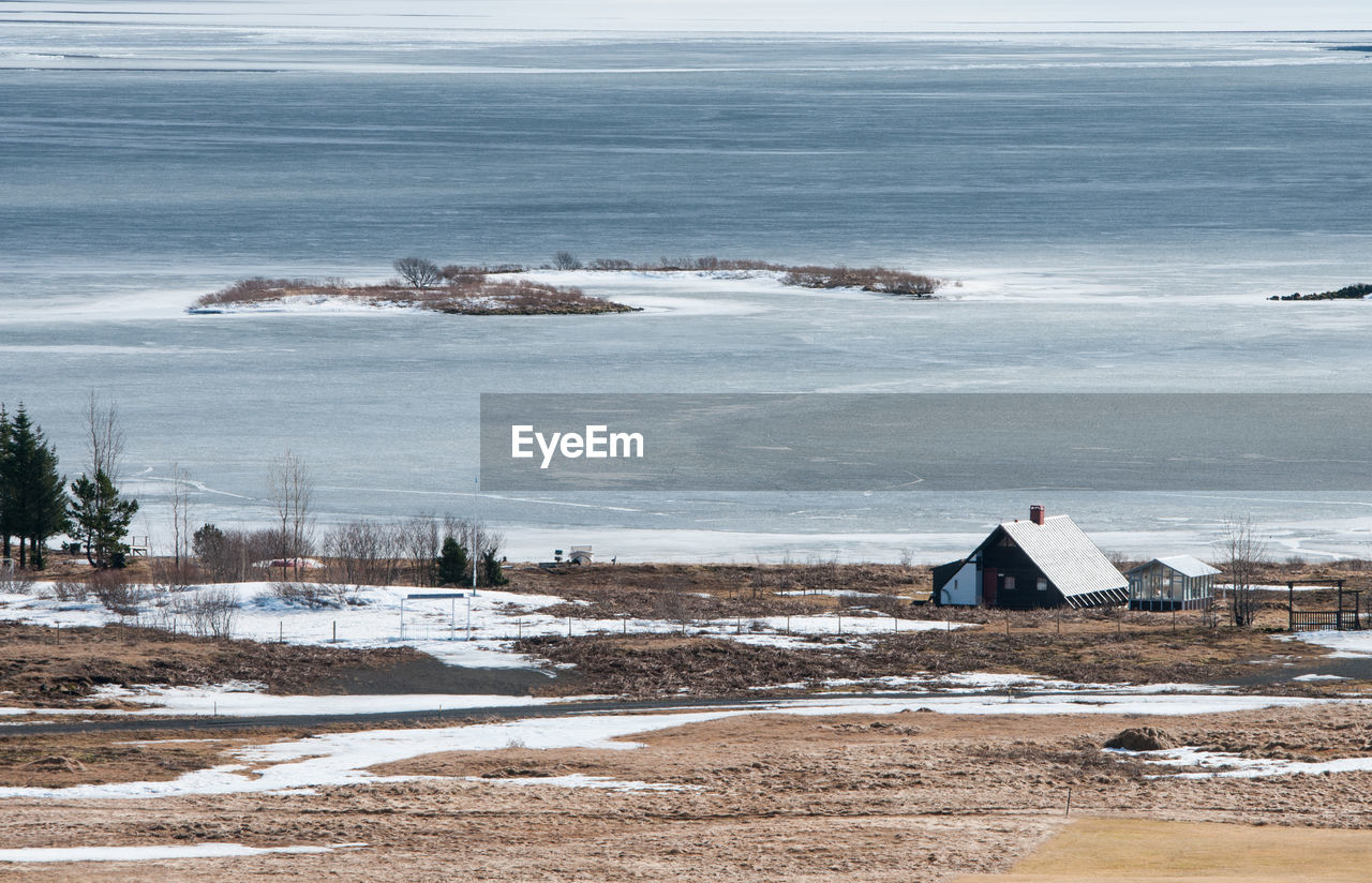 Scenic view of sea against sky during winter