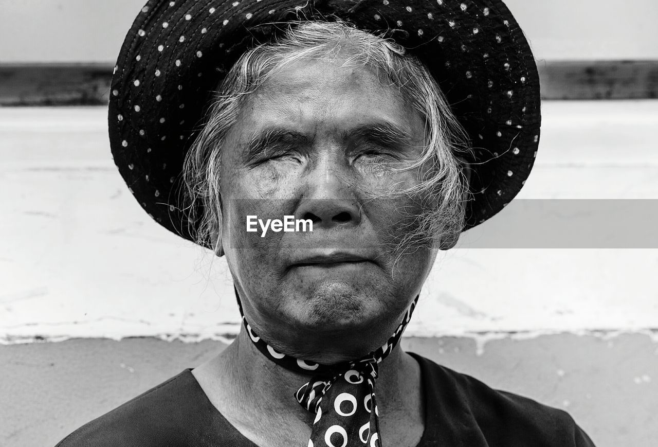 Close-up of blind woman wearing hat