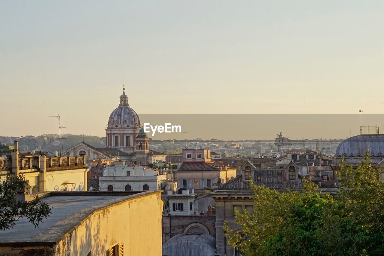 Buildings in city against sky