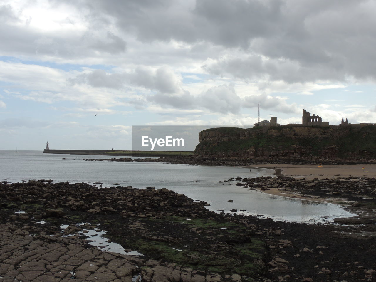 SCENIC VIEW OF SEA AGAINST BUILDINGS