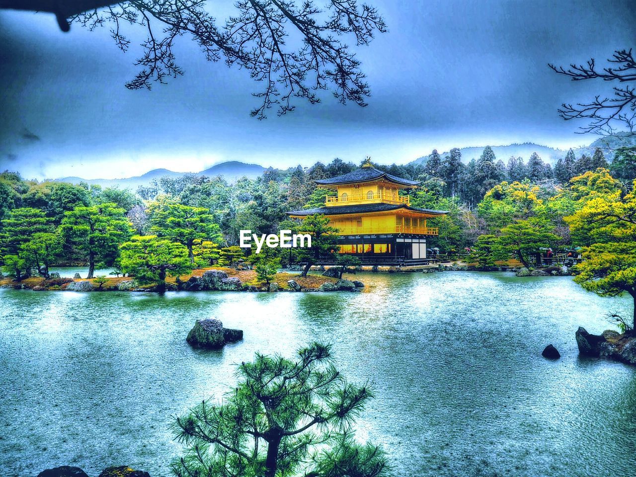 SCENIC VIEW OF LAKE WITH BUILDINGS IN BACKGROUND