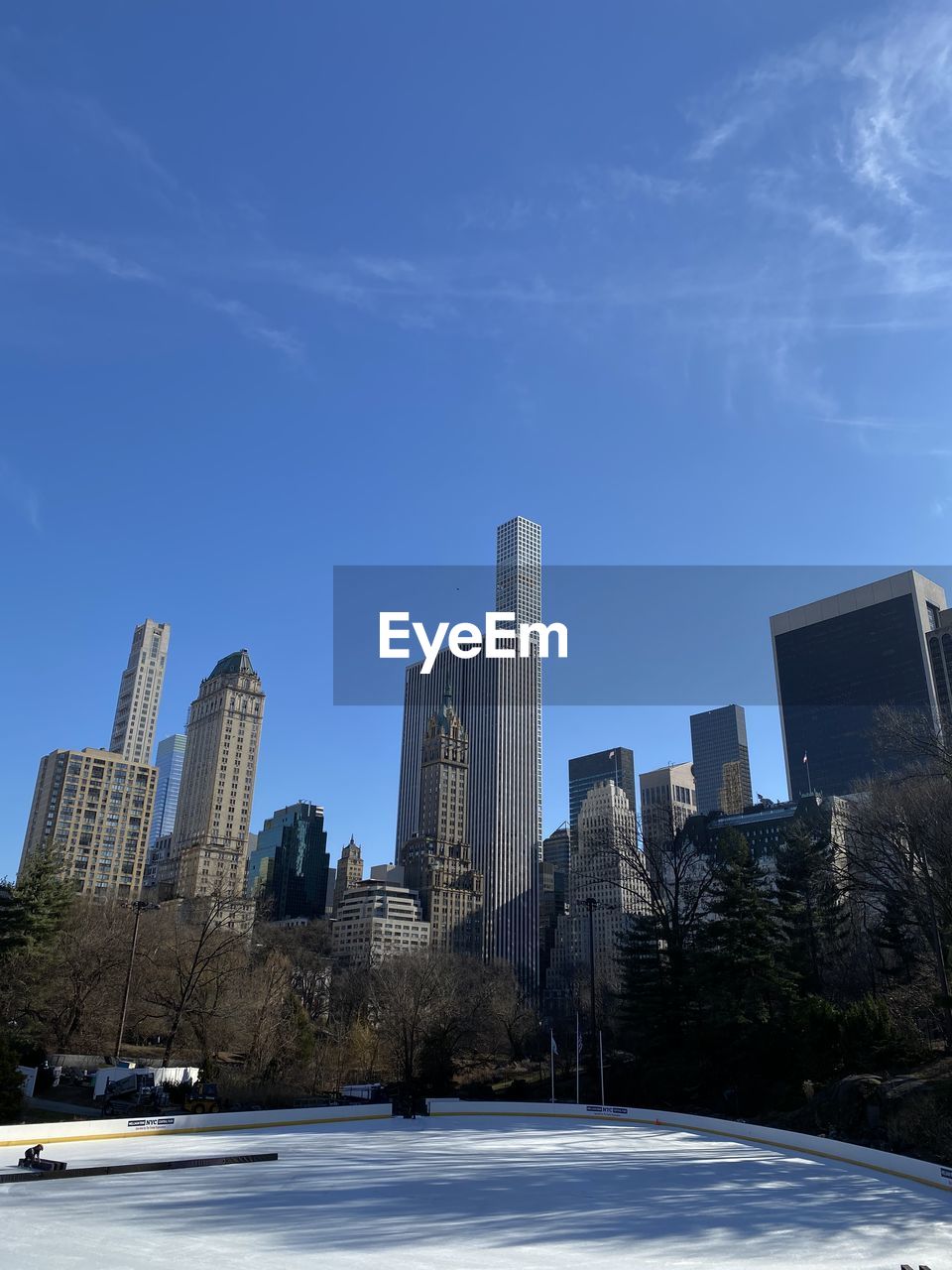 BUILDINGS AGAINST BLUE SKY DURING WINTER