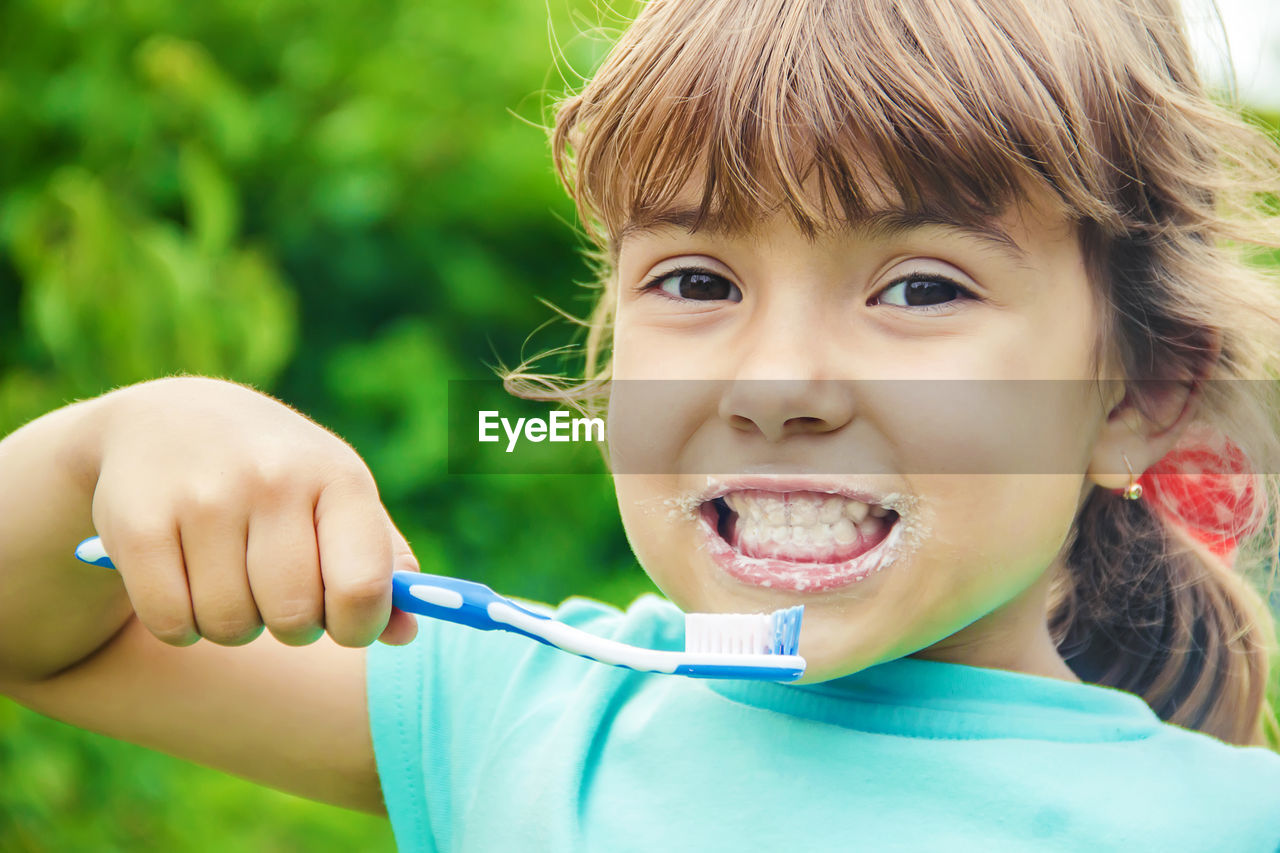 close-up of cute girl playing with eyes