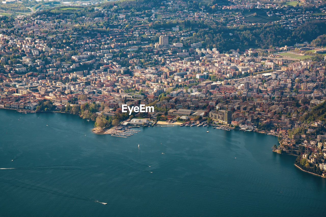 High angle view of lake amidst buildings in city