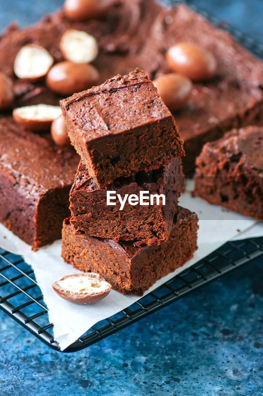 Close-up of chocolate cake on cooling rack